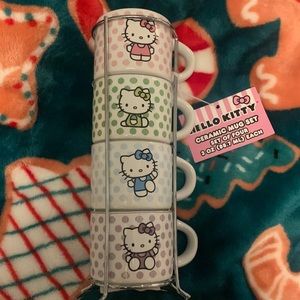 NWT Hello Kitty set of four 3oz mugs in metal frame